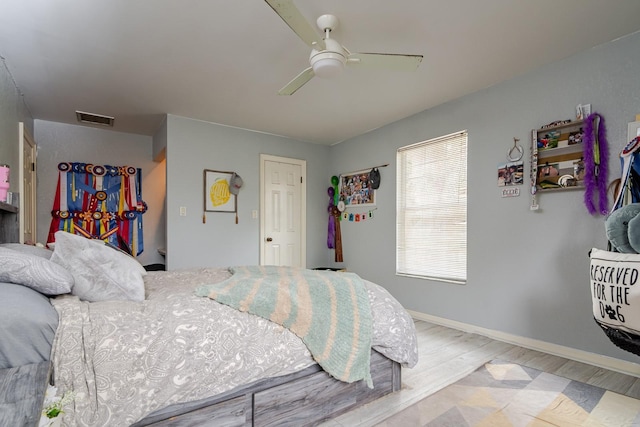 bedroom featuring hardwood / wood-style flooring and ceiling fan