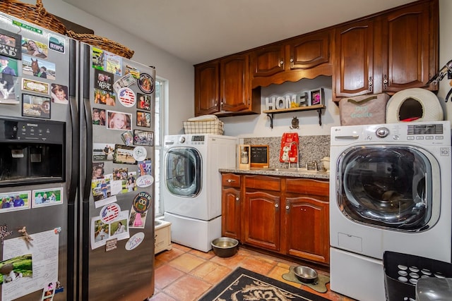 laundry area with sink and independent washer and dryer