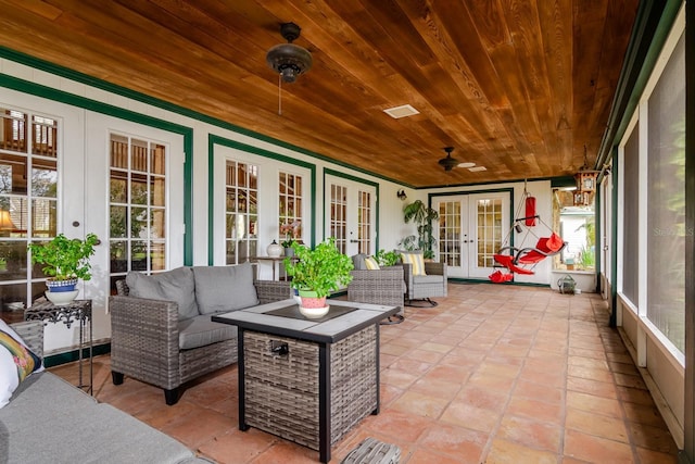 sunroom / solarium with french doors and wood ceiling