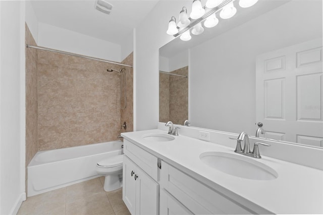 bathroom with shower / tub combination, a sink, toilet, and tile patterned floors