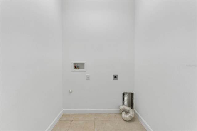 laundry room featuring light tile patterned floors, laundry area, baseboards, hookup for a washing machine, and hookup for an electric dryer