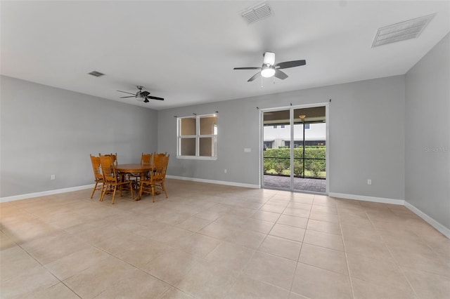 unfurnished dining area featuring a ceiling fan, visible vents, and baseboards