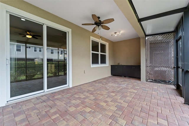 view of patio featuring a ceiling fan