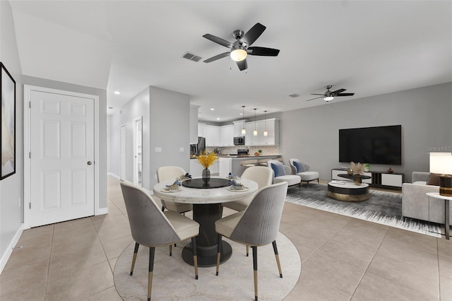 dining room featuring light tile patterned floors, ceiling fan, recessed lighting, visible vents, and baseboards