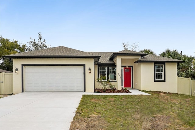 view of front facade featuring a garage and a front yard