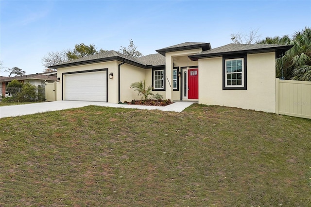 view of front of house with a garage and a front lawn