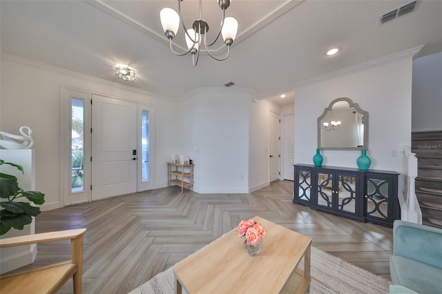 living room with ornamental molding, light parquet flooring, and a notable chandelier