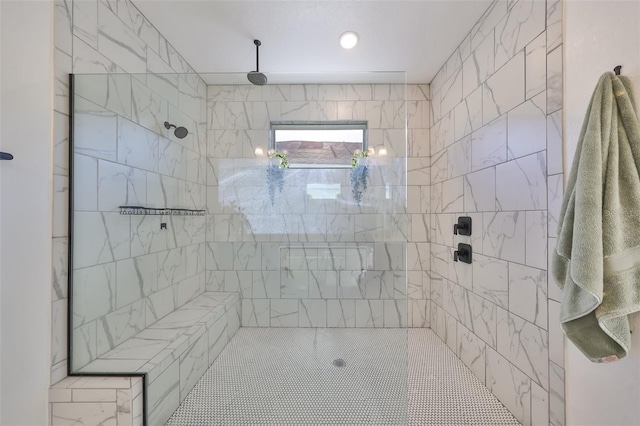 bathroom featuring a tile shower