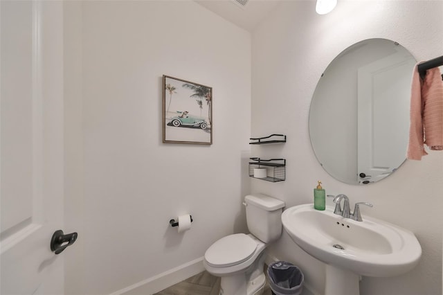 bathroom with sink and toilet