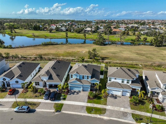 birds eye view of property featuring a water view