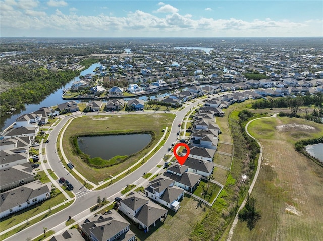 bird's eye view with a water view