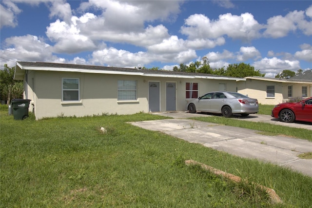 ranch-style house with a front lawn