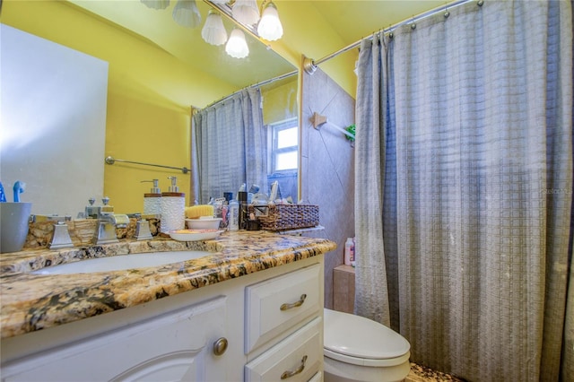 bathroom with vanity, toilet, and a shower with shower curtain