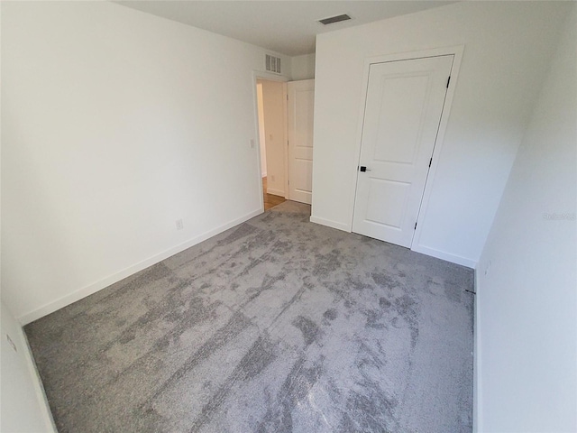 unfurnished bedroom with carpet floors