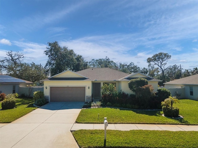 ranch-style house featuring a garage and a front lawn