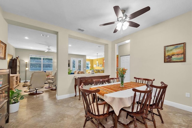 dining space featuring ceiling fan