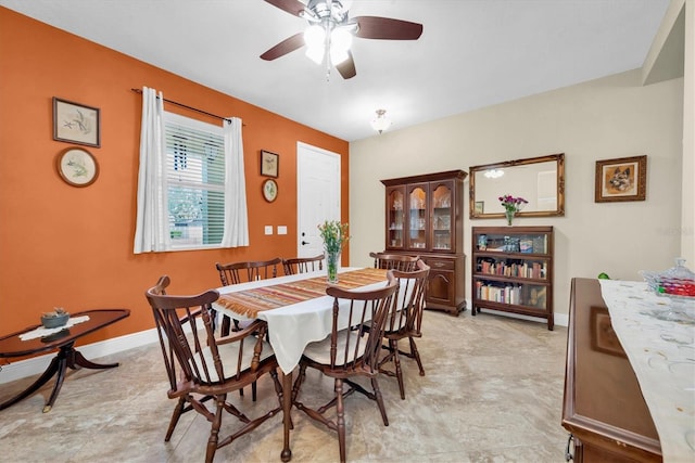 dining space featuring ceiling fan