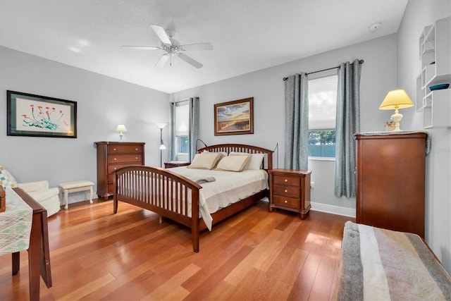 bedroom featuring hardwood / wood-style floors and ceiling fan