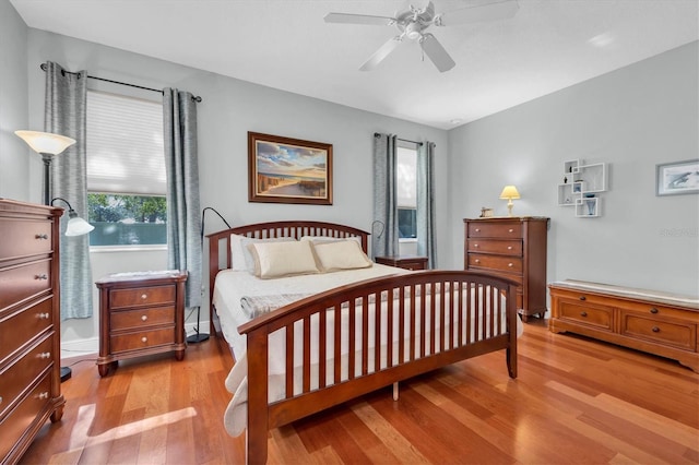 bedroom featuring ceiling fan and light hardwood / wood-style flooring