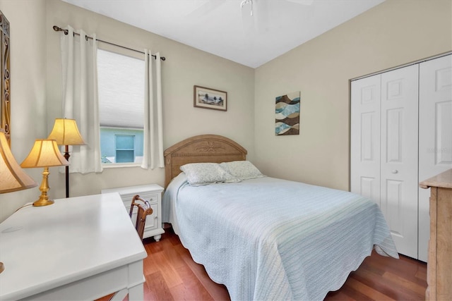 bedroom featuring dark hardwood / wood-style flooring, a closet, and ceiling fan