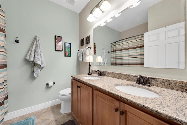 bathroom with tile patterned flooring, vanity, a shower with curtain, and toilet