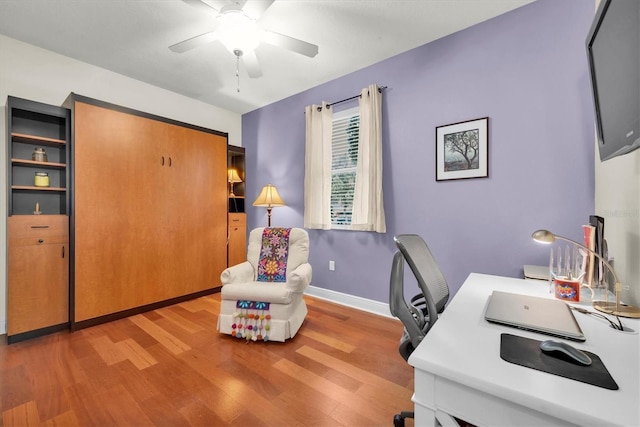 office with ceiling fan and wood-type flooring