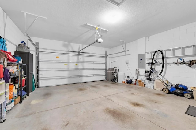 garage featuring a garage door opener and electric panel