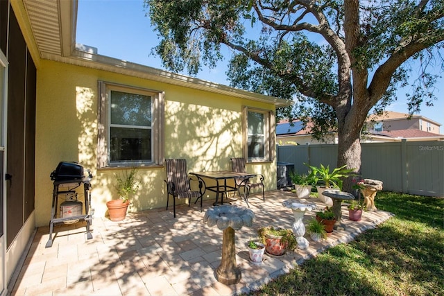 rear view of property featuring a patio area