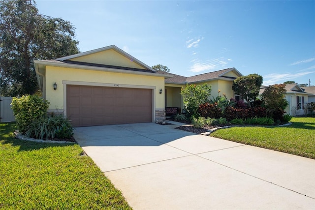 ranch-style home with a garage and a front yard