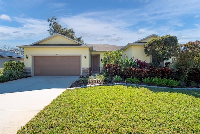 single story home featuring a garage and a front lawn