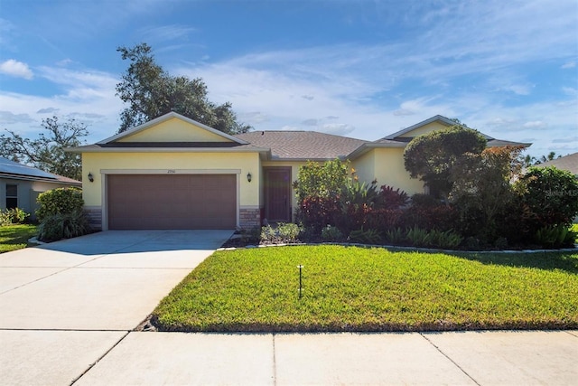 ranch-style house featuring a garage and a front yard