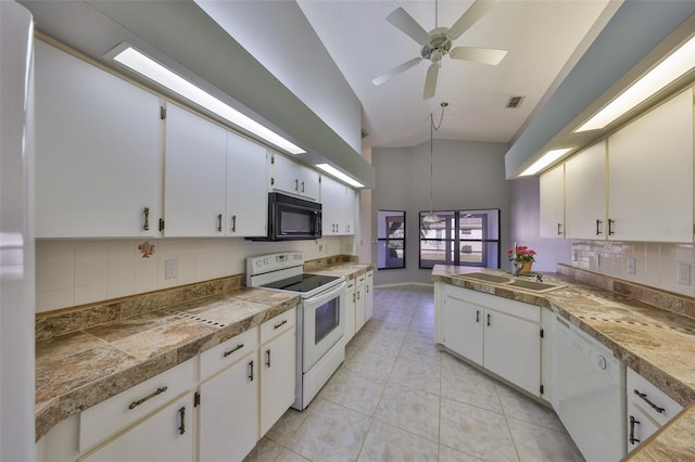 kitchen with sink, white cabinets, white appliances, and decorative backsplash