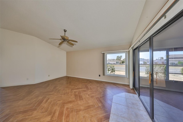 unfurnished room with parquet floors, ceiling fan, and lofted ceiling