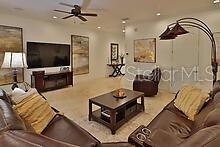 living room featuring ceiling fan