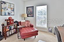 living area featuring light colored carpet