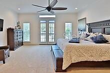 carpeted bedroom featuring ceiling fan