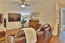 living room featuring ceiling fan