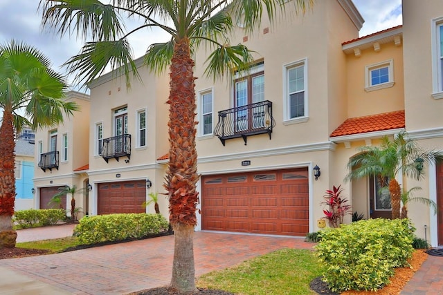 3222 W Empedrado St, Tampa, FL 33629 - view of front of property with stucco siding, an attached garage, a tiled roof, and decorative driveway