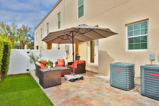 3222 W Empedrado St, Tampa, FL 33629 - view of patio / terrace featuring an outdoor living space, fence, and central AC