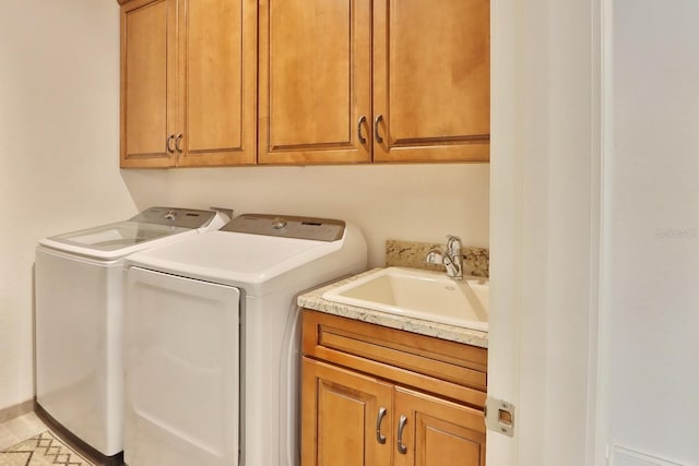 3222 W Empedrado St, Tampa, FL 33629 - washroom with a sink, washer and clothes dryer, and cabinet space