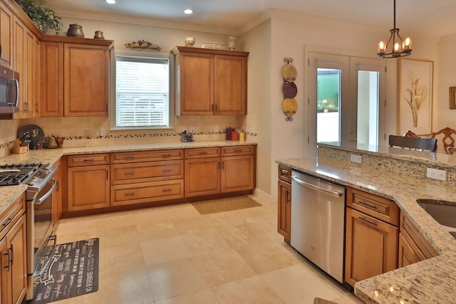 3222 W Empedrado St, Tampa, FL 33629 - kitchen with backsplash, brown cabinetry, and appliances with stainless steel finishes