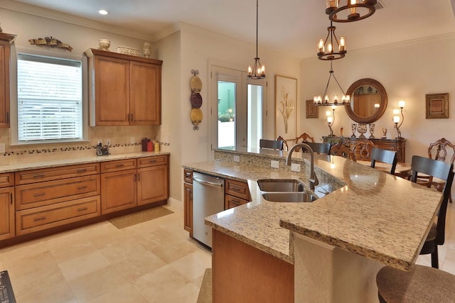 3222 W Empedrado St, Tampa, FL 33629 - kitchen with a kitchen bar, stainless steel dishwasher, a sink, an inviting chandelier, and backsplash