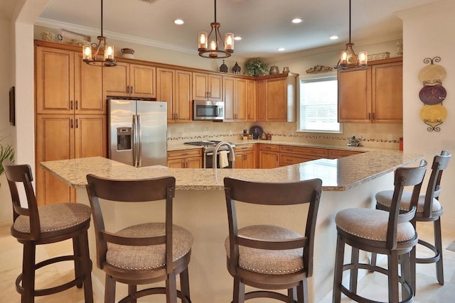 3222 W Empedrado St, Tampa, FL 33629 - kitchen featuring a notable chandelier, brown cabinetry, tasteful backsplash, and stainless steel appliances
