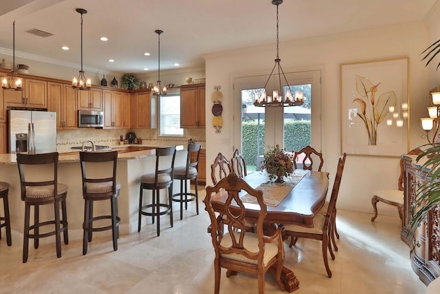 3222 W Empedrado St, Tampa, FL 33629 - dining area featuring visible vents, crown molding, and a chandelier