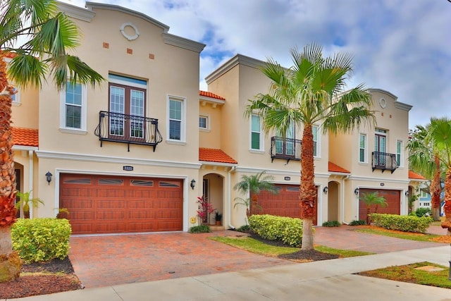 3222 W Empedrado St, Tampa, FL 33629 - mediterranean / spanish-style home with stucco siding, a tile roof, a garage, and decorative driveway