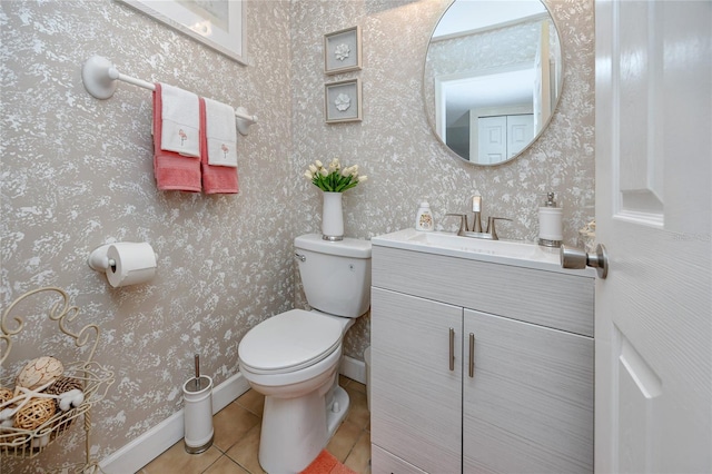 bathroom with vanity, toilet, and tile patterned flooring