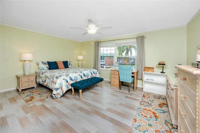 bedroom featuring ceiling fan and crown molding