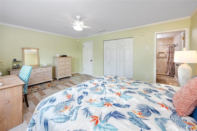 bedroom with ceiling fan, crown molding, light hardwood / wood-style floors, and ensuite bath