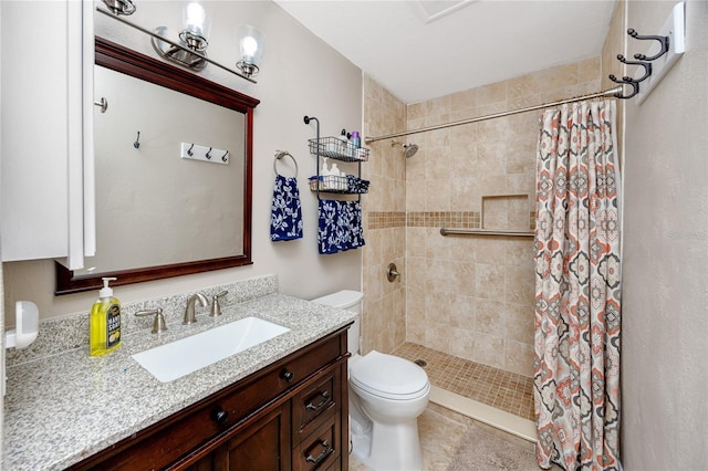 bathroom with toilet, vanity, and a shower with curtain