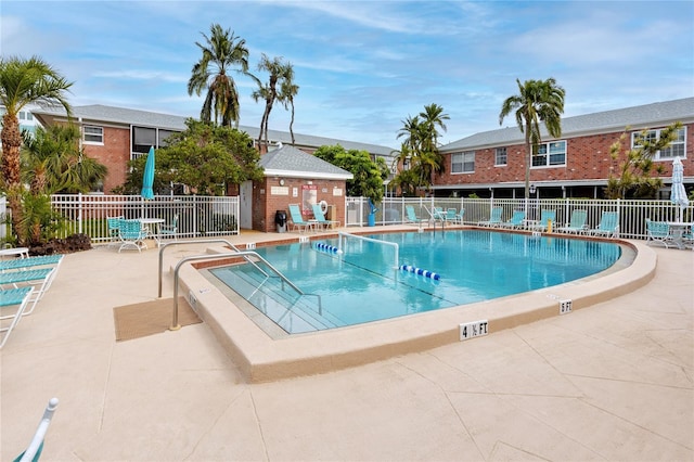 view of swimming pool with a patio